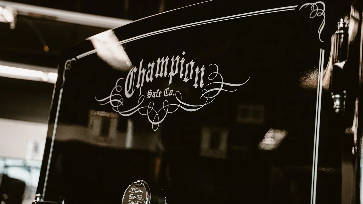 Close-up of a black Champion safe door and logo