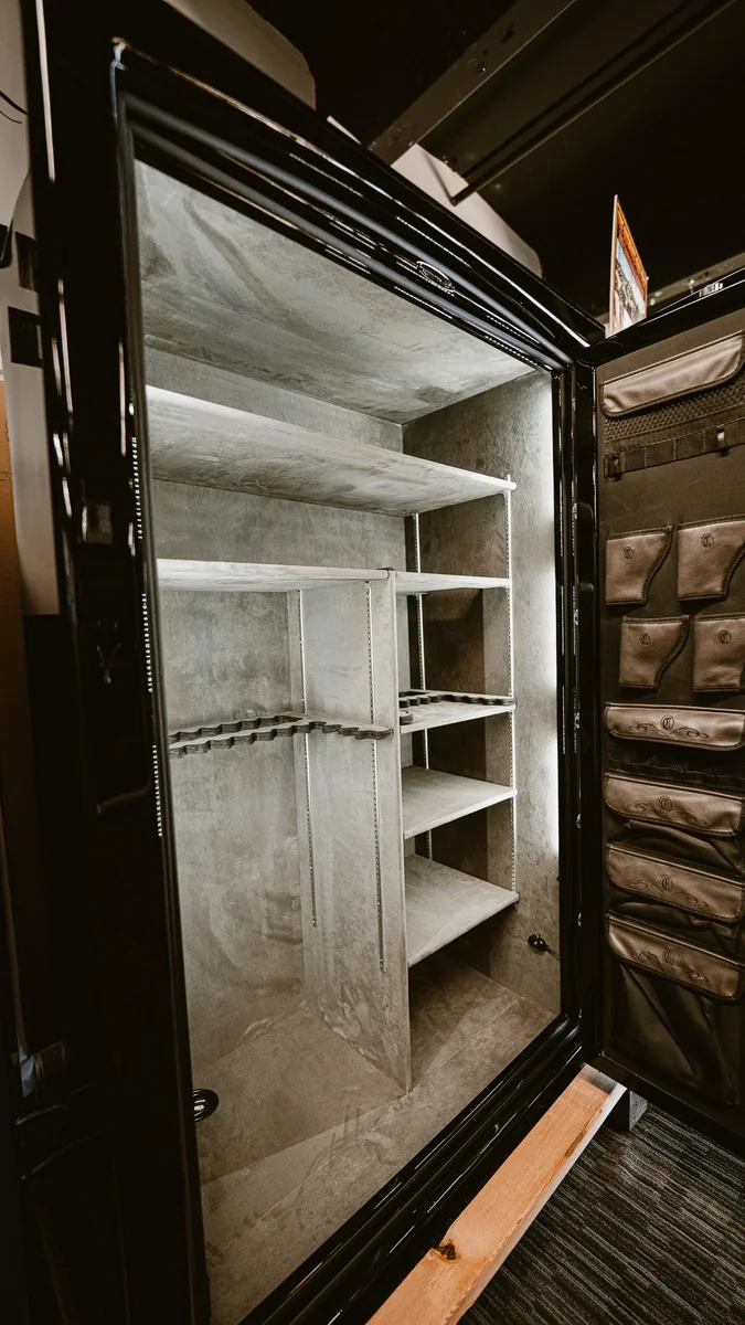 Open Champion safe showing adjustable shelves, firearm storage and door organizers
